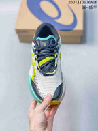 Top view of the shoe showing the navy tongue, dark laces, lime lace details, and white mesh-like upper.