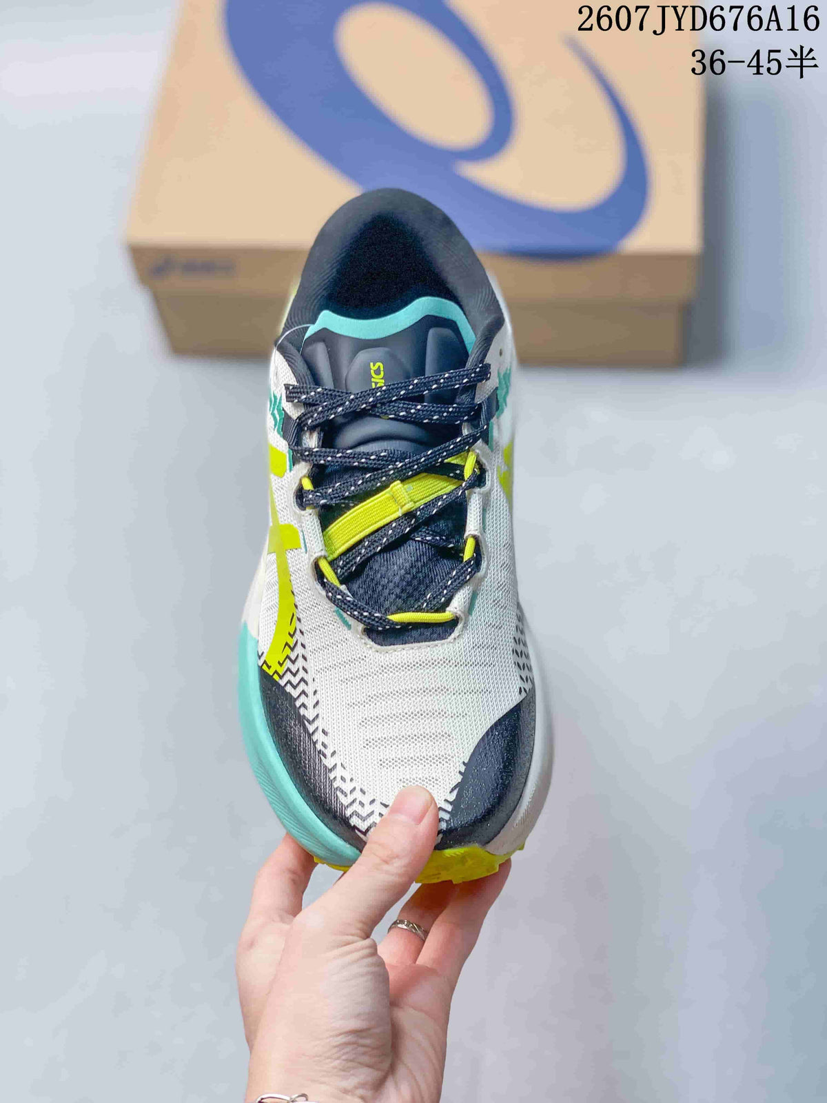 Top view of the shoe showing the navy tongue, dark laces, lime lace details, and white mesh-like upper.