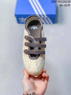 Top view showing the rounded toe, perforated panels and three brown straps.