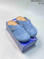 Blue two-buckle closed-toe clog sandals displayed on a Birkenstock-branded box.
