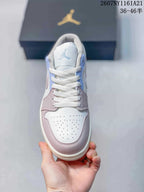 Top view showing white laces, a perforated white toe box, pink overlays and a light blue tongue detail.