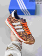 Leopard-print adidas SL 72 sneaker with orange laces, white side stripes and a red midsole accent.