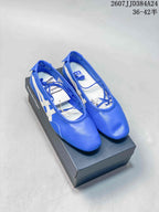 Blue Onitsuka Tiger GYMNARINA Mary Jane shoes displayed on a black shoe box, with white side stripes and the style code visible above.