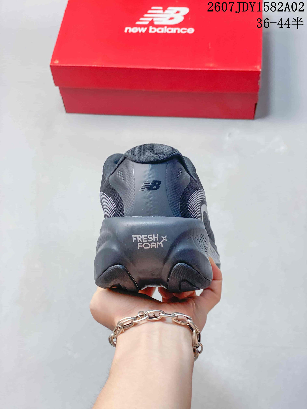 Rear view of a New Balance shoe showing the Fresh Foam X heel marking