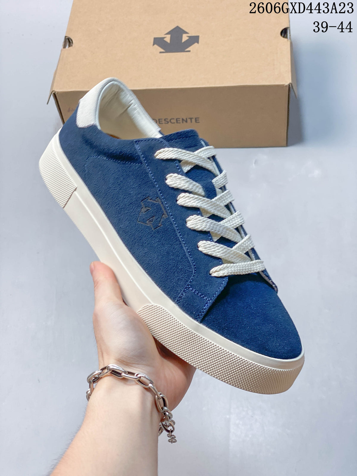 Close view of the blue T-toe sneaker with cream laces and contrasting sole