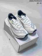 Pair of white Saucony running shoes with pale blue-gray details and dark lining; image text states 36–45.