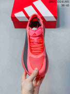 Top view of the pink lace-up running shoe with dark side panels