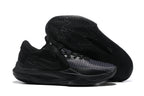 All-black basketball shoe with a dark patterned outsole.