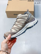 Side profile of the beige Salomon XA Pro 3D shoe