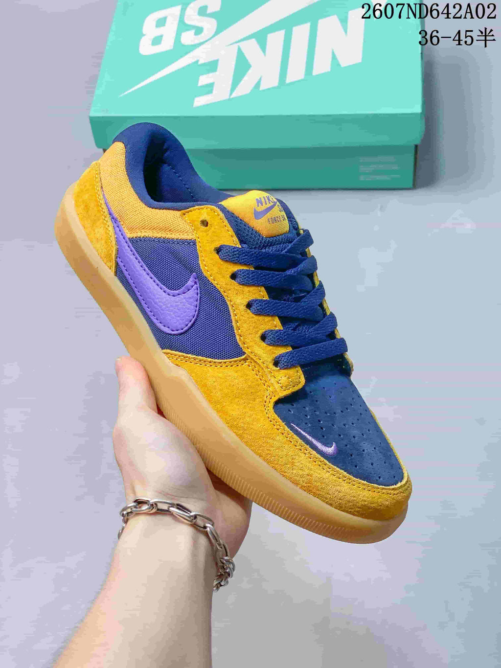 Angled view of the yellow, navy, and purple Nike SB Force 58 low-top shoe