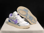 Angled product view with one sneaker lifted to reveal the cream-colored outsole and gray tread inserts.