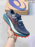 Navy ASICS GEL-TRABUCO 13 trail shoe with orange accents and a lugged outsole