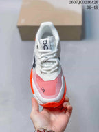 Top view showing the white laces, padded collar, tongue branding and pink mesh toe panel.