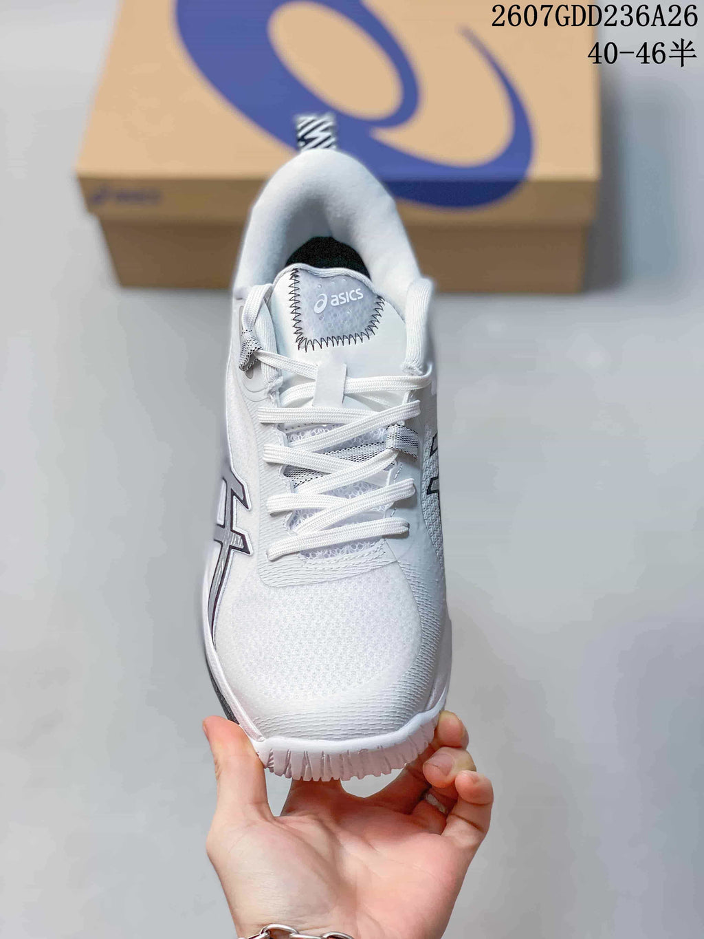 Top view of the white ASICS Swiftace sneaker showing the tongue branding, lace-up closure, and textured toe area.