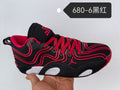 Side view of black Jordan 680-6 sneakers with red laces and wavy red detailing, plus white outsole accents.