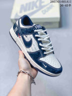 Three-quarter side view showing the navy and white upper, repeated OFF-WHITE text on the side panel, white midsole, and dark outsole.
