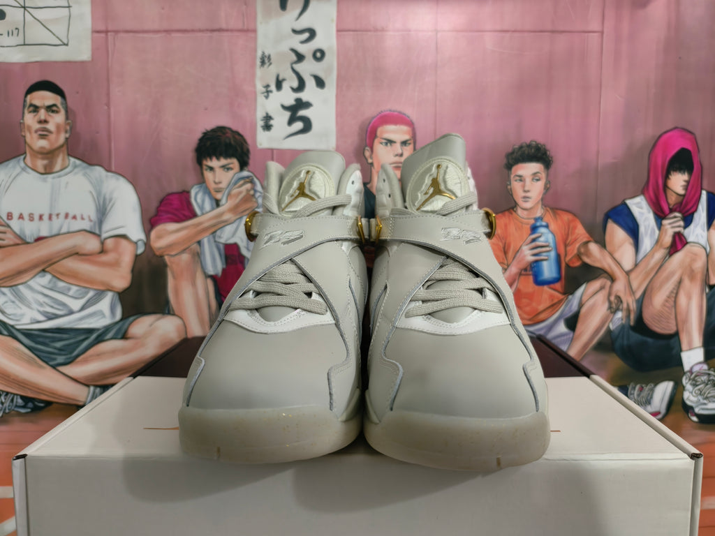 Front view showing the tongue branding and cross-strap details on the sneakers