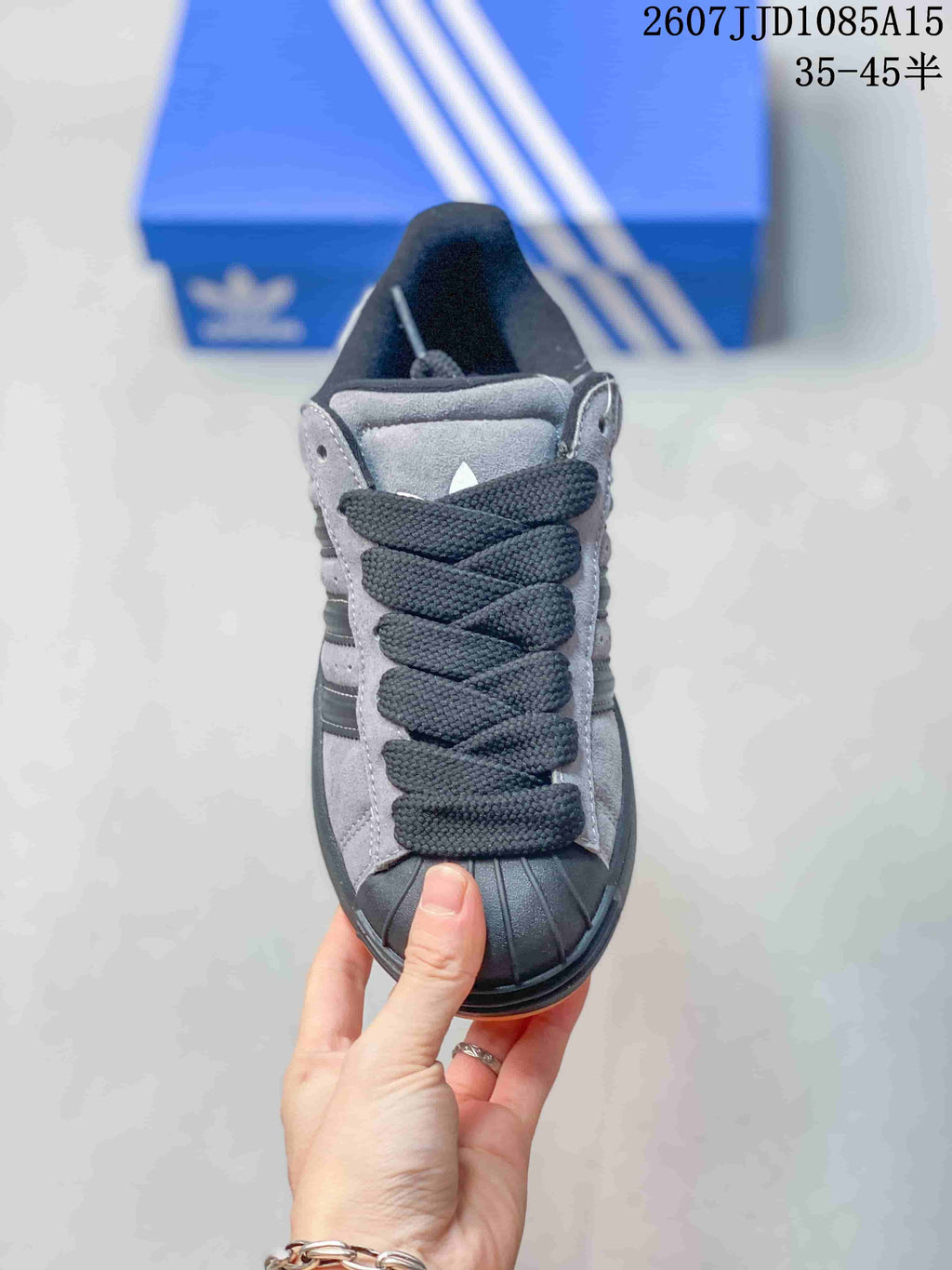 Top view showing the black laces, grey panels and shell toe.