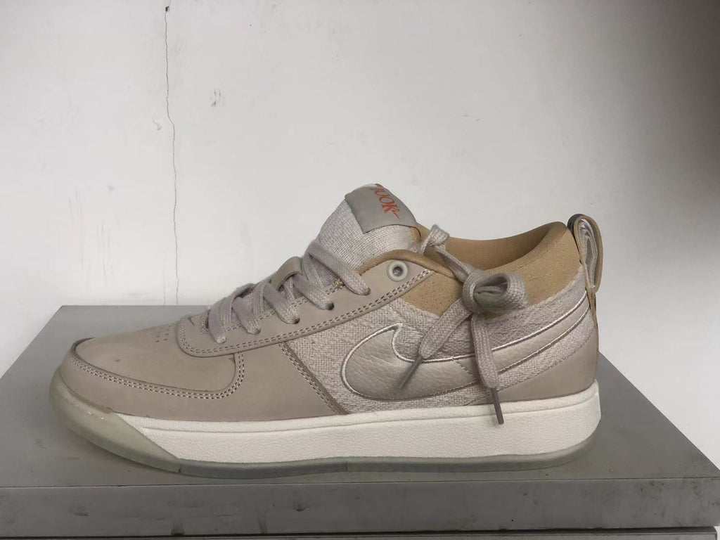 Nike Book 1 Ashen Slate shoe in side profile, showing its lace-up design and white midsole.