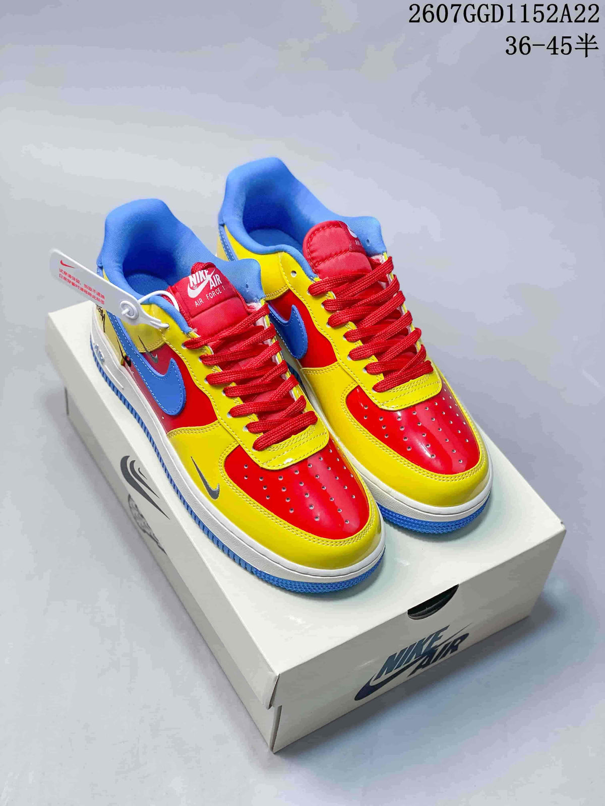 Pair of multicolor Nike Air Force 1 low-top sneakers displayed on a Nike shoebox; image text shows a 36–45.5 size range.