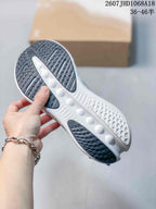 Bottom view of the sneaker showing the black-and-white patterned outsole and sculpted central section.