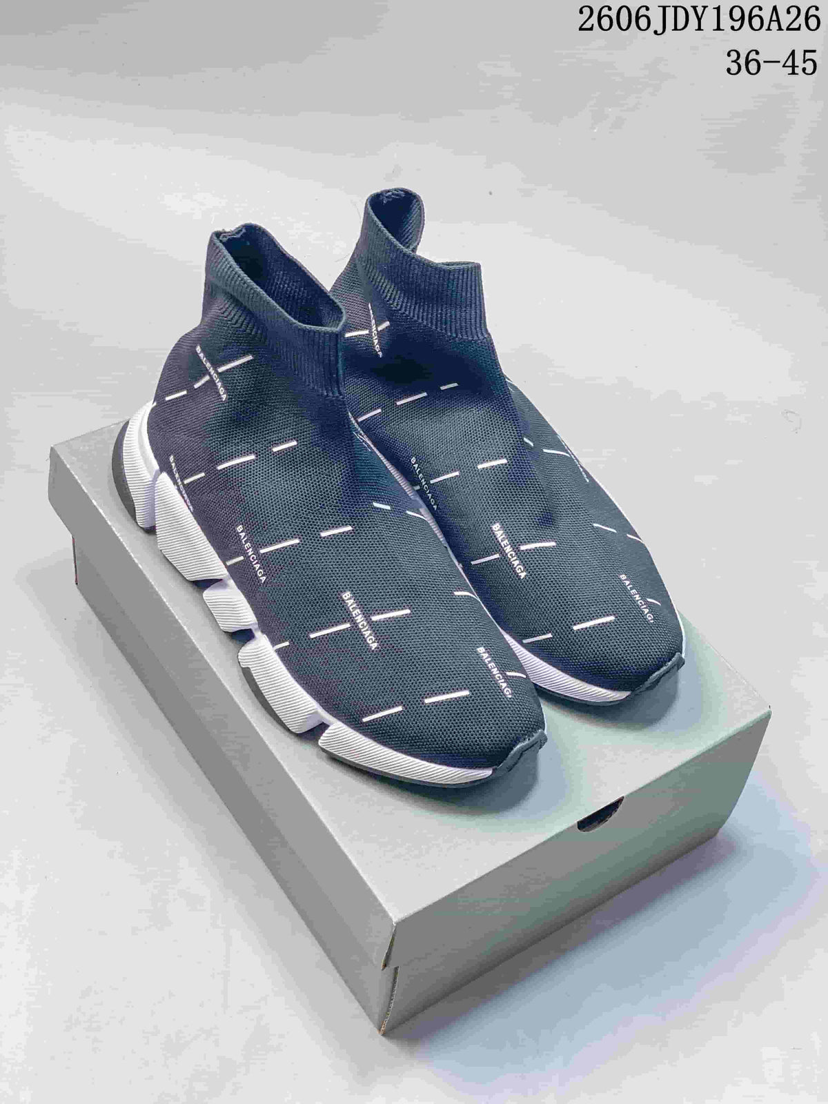 Pair of dark navy Balenciaga sock sneakers displayed on a box, showing white dash details and segmented white soles.