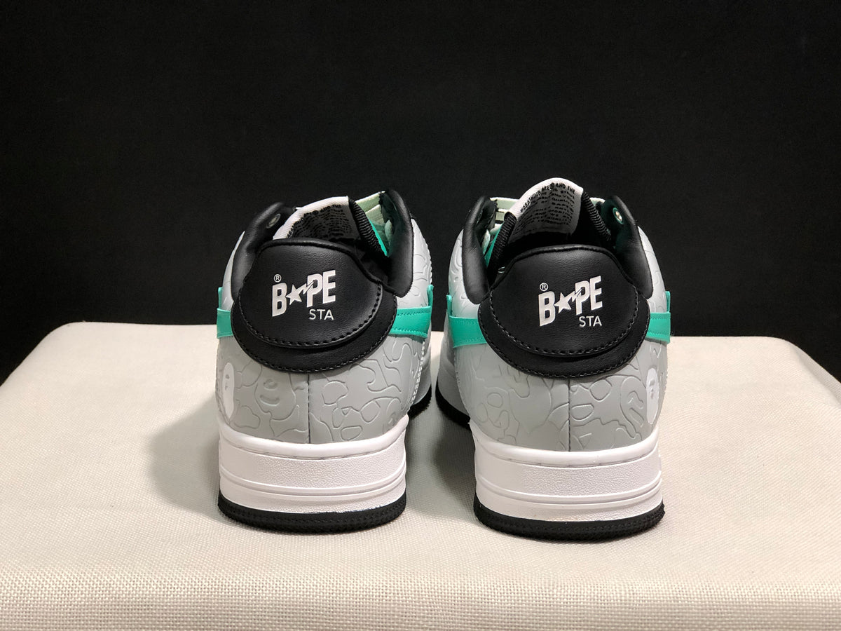 Rear view showing BAPE STA branding on the black heel tabs and textured grey heel panels.