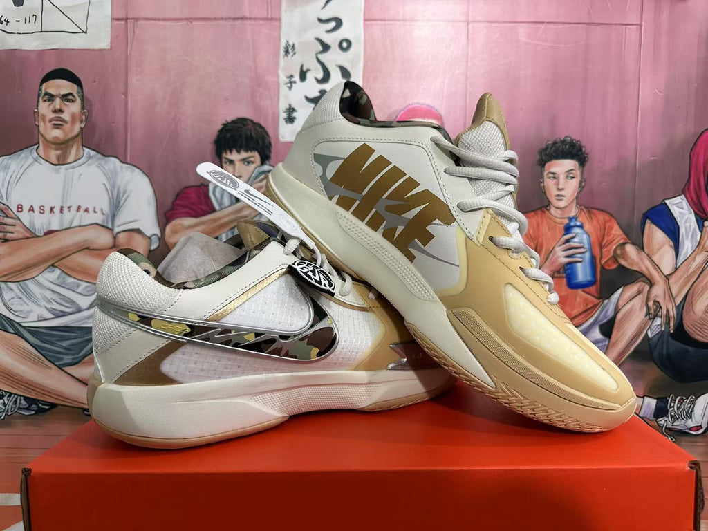 Angled view of white and yellow Nike basketball shoes with prominent side branding