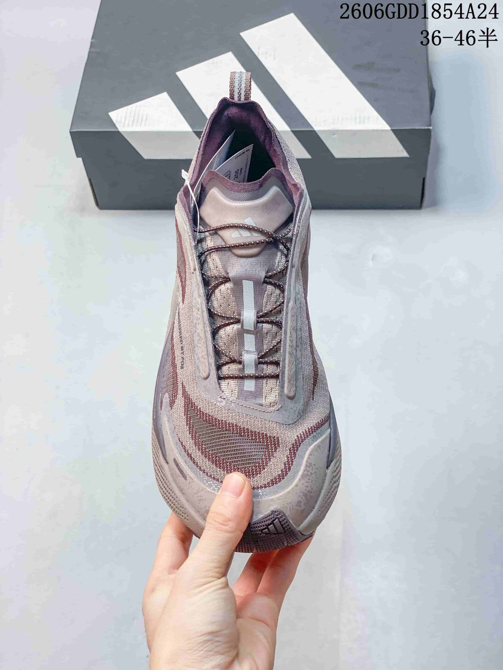 Top view of a mauve trail running shoe showing its laces and tongue