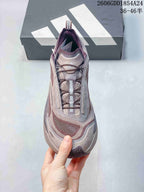 Top view of a mauve trail running shoe showing its laces and tongue