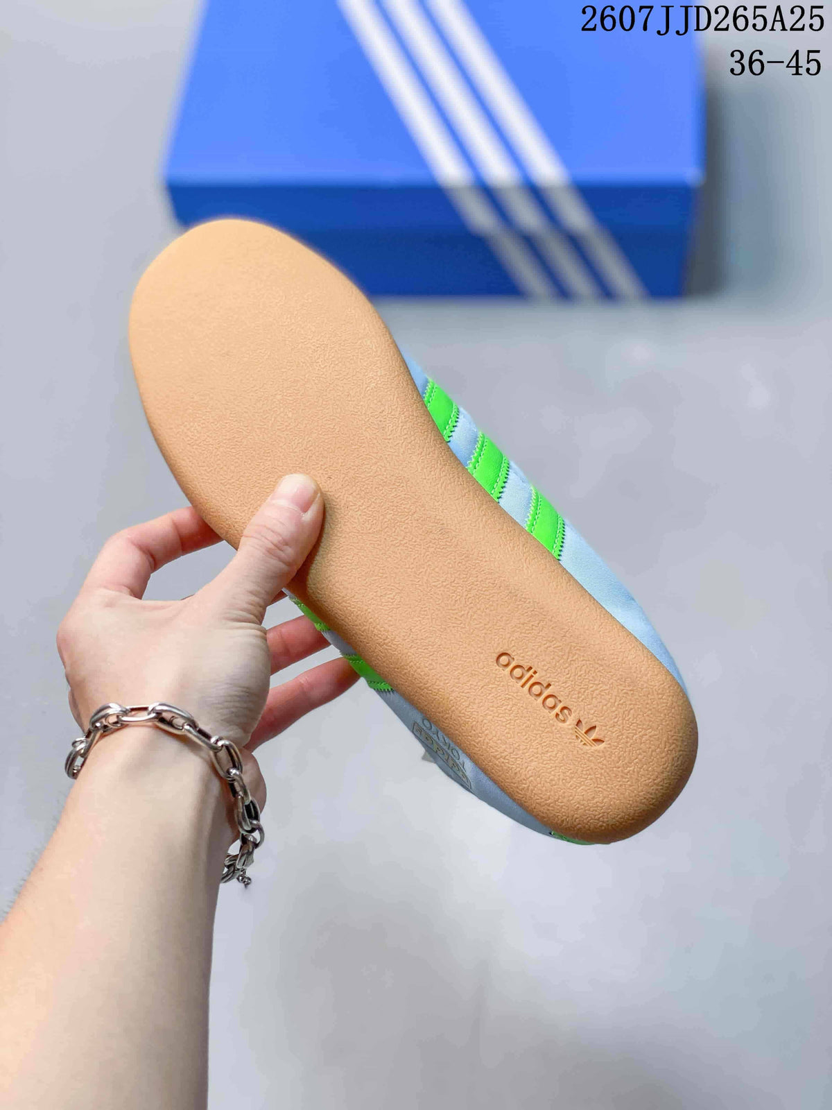 Close view of the gum-colored outsole with adidas branding.