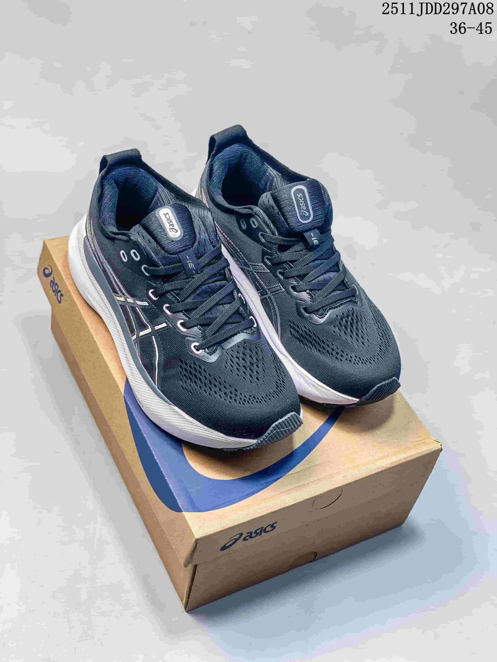 Pair of black and navy Asics sneakers with white midsoles displayed on an Asics shoebox; image text shows style code 2511JDD297A08 and size range 36–45.