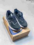 Pair of black and navy Asics sneakers with white midsoles displayed on an Asics shoebox; image text shows style code 2511JDD297A08 and size range 36–45.