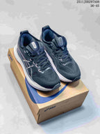 Pair of black and navy Asics sneakers with white midsoles displayed on an Asics shoebox; image text shows style code 2511JDD297A08 and size range 36–45.