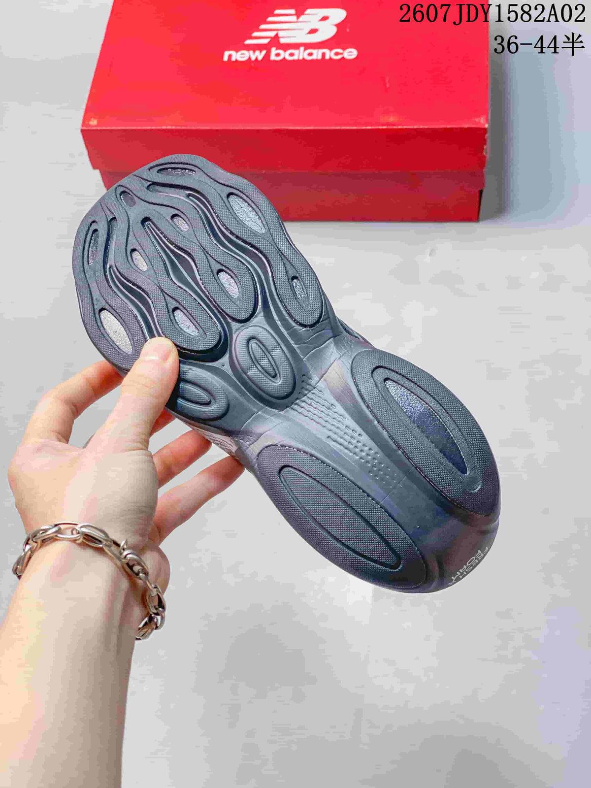 Sculpted outsole of a dark gray New Balance running shoe