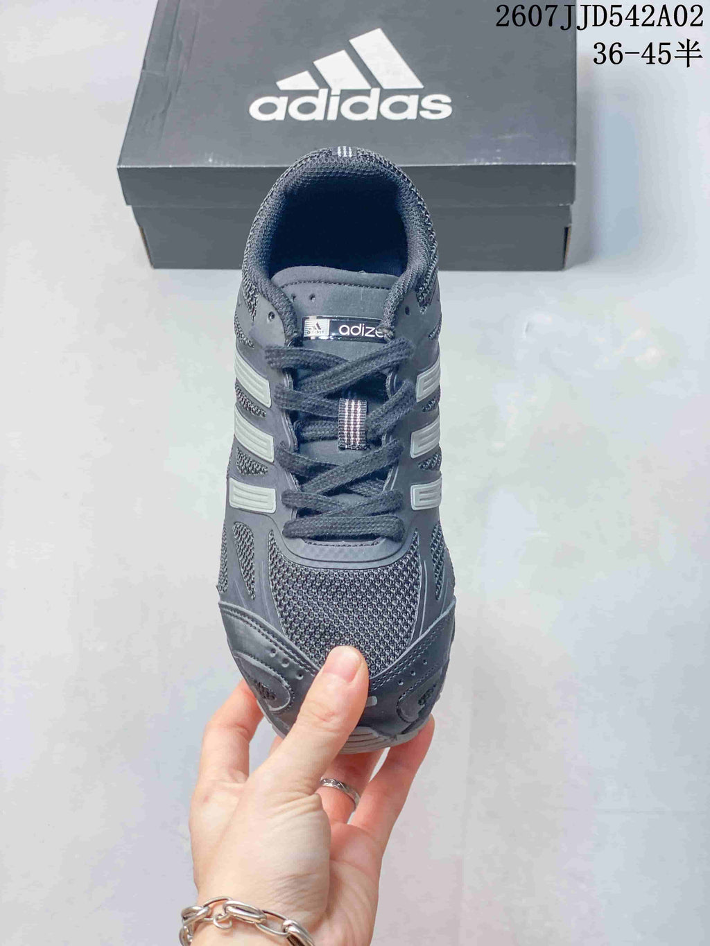 Front view of the charcoal gray lace-up sneaker