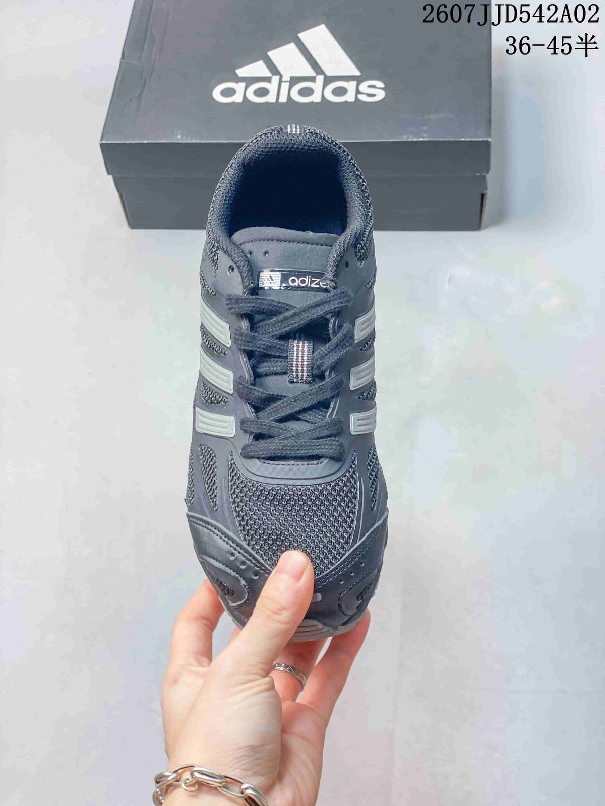 Front view of the charcoal gray lace-up sneaker