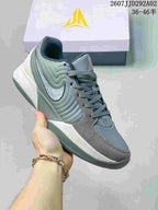 Grey and sage Nike JA 2 basketball shoe with a reflective-looking Swoosh detail.