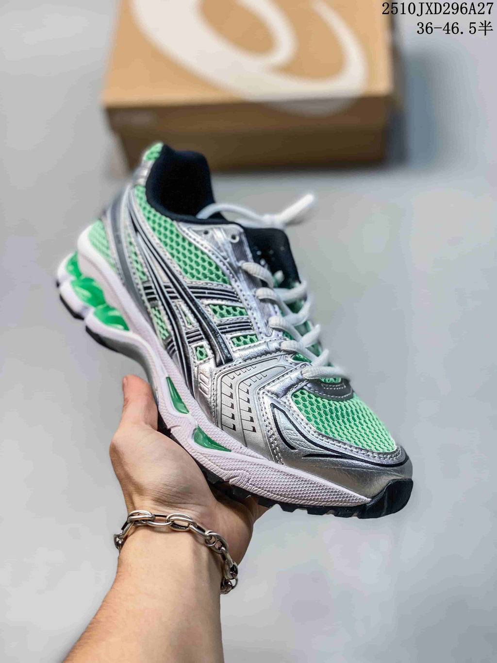 Silver sneaker with bright green mesh panels and white laces