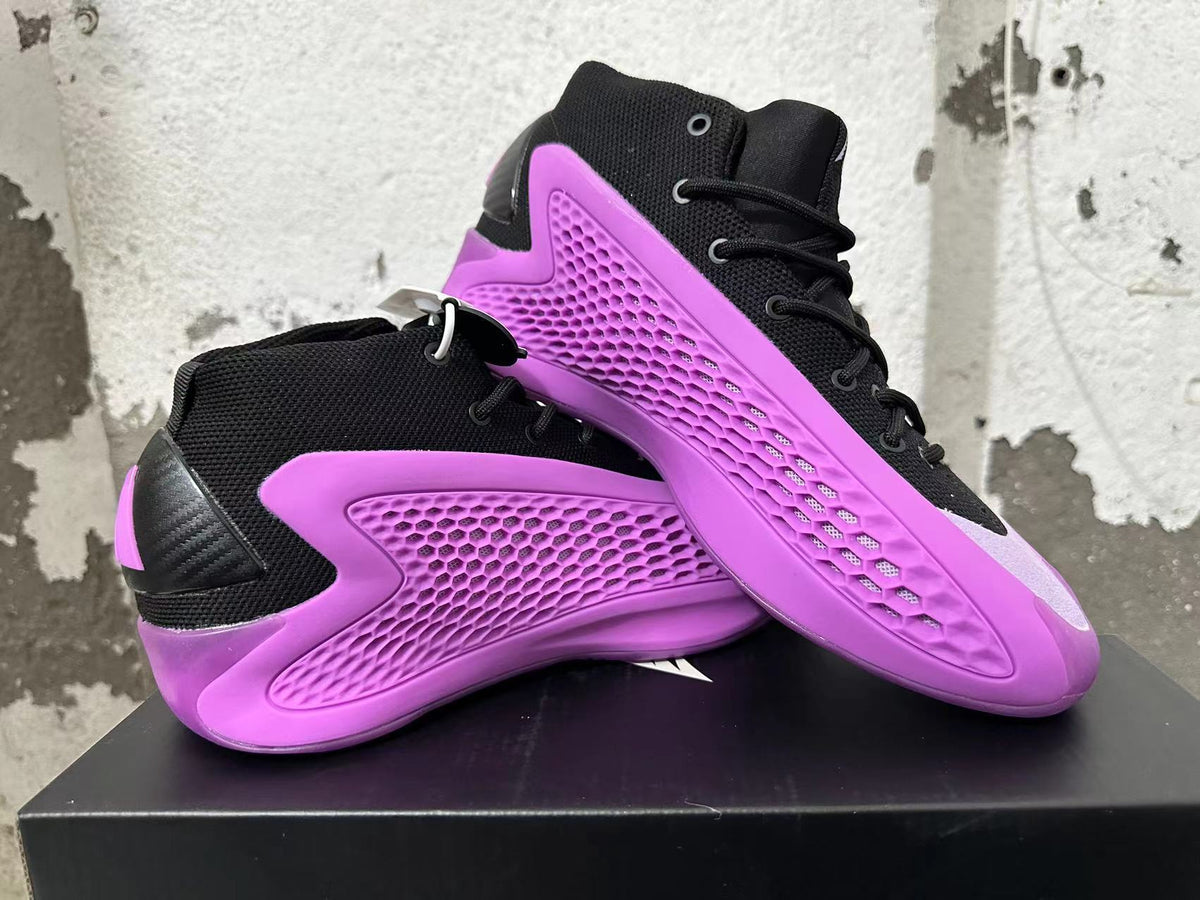Two purple and black high-top sneakers displayed at an angle