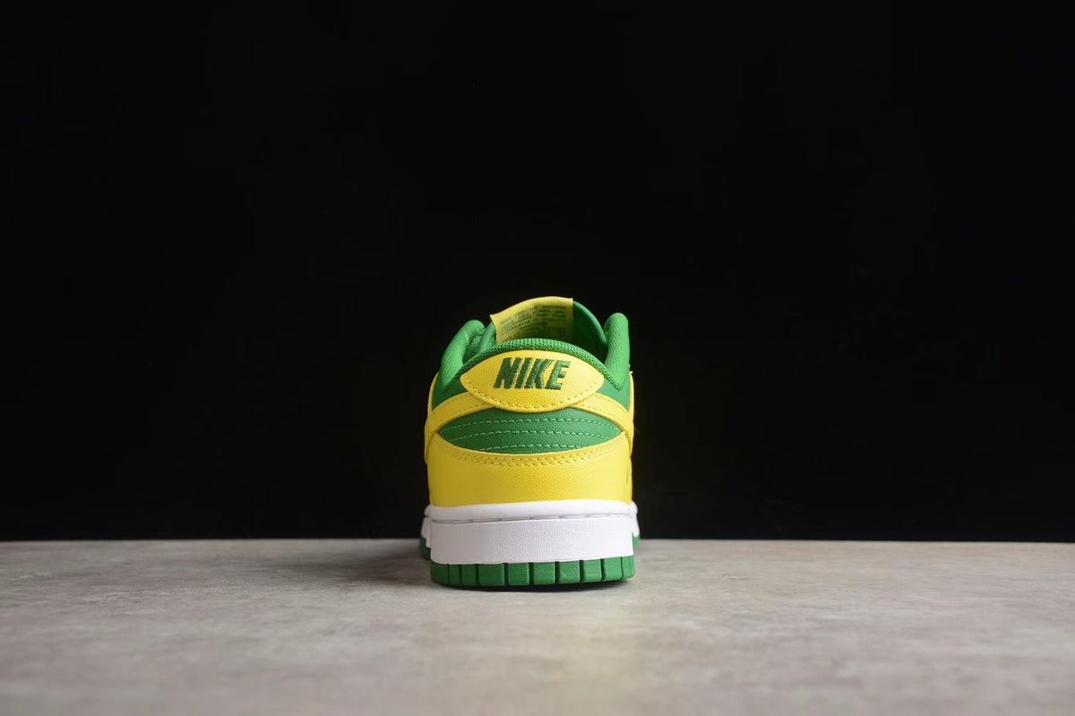Rear view showing the green and yellow heel construction, white midsole, and green outsole.