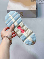 Underside view of an On sneaker showing the segmented outsole, CloudTec branding and light blue traction sections.