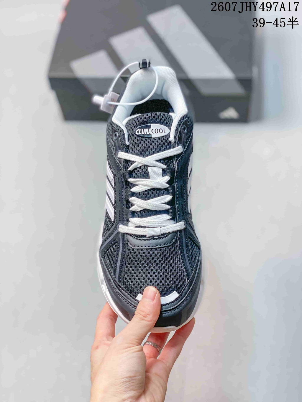Top view showing the mesh toe box, white laces, padded tongue, and Climacool tongue branding.