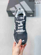Top view showing the mesh toe box, white laces, padded tongue, and Climacool tongue branding.
