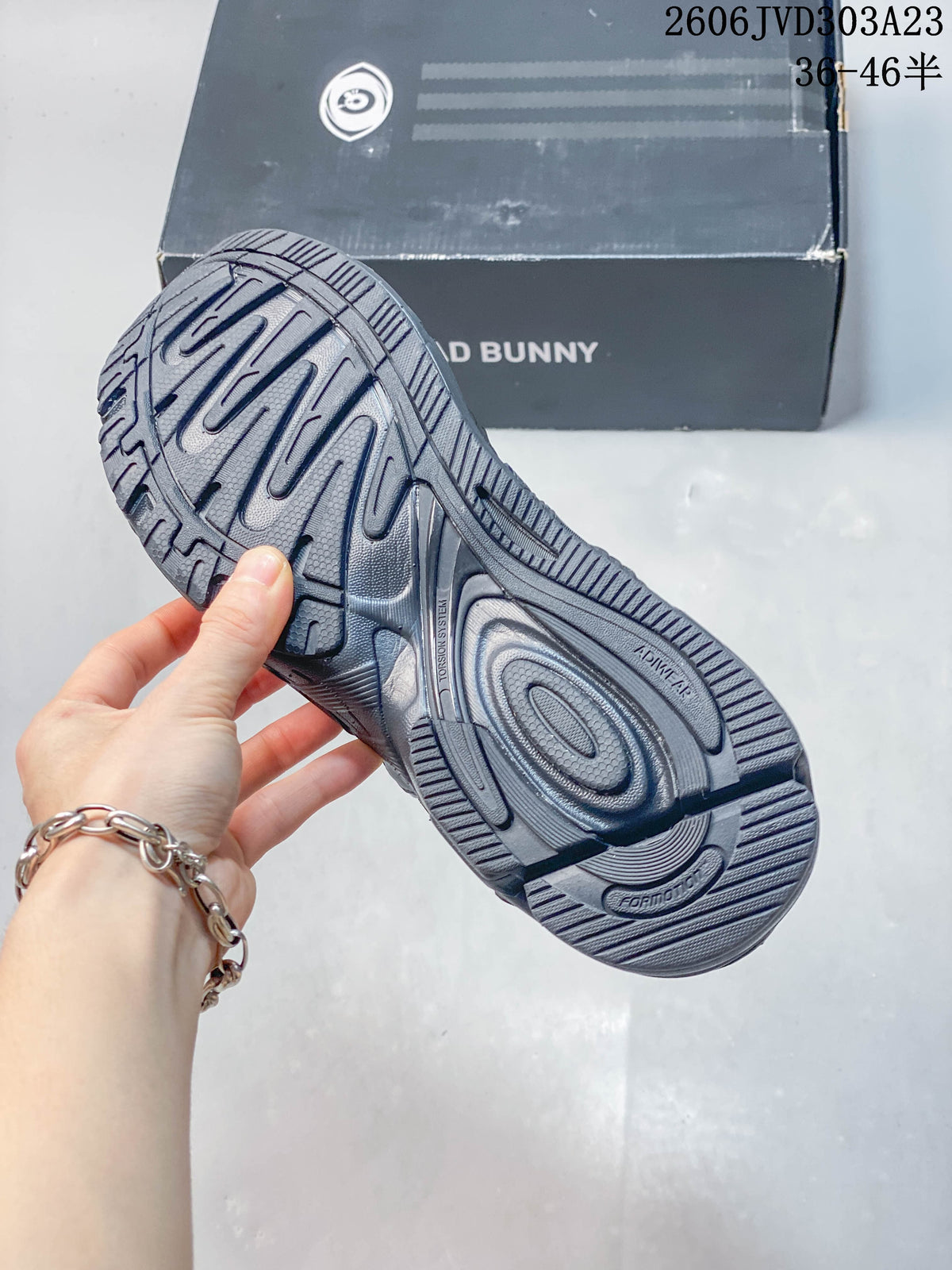 Outsole view of a grey adidas Response CL sneaker