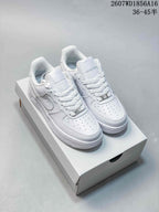 Pair of white Nike Air Force 1 '07 Low sneakers displayed on a shoebox; source text shows style code 2607WD1856A16 and size range 36–45.5.