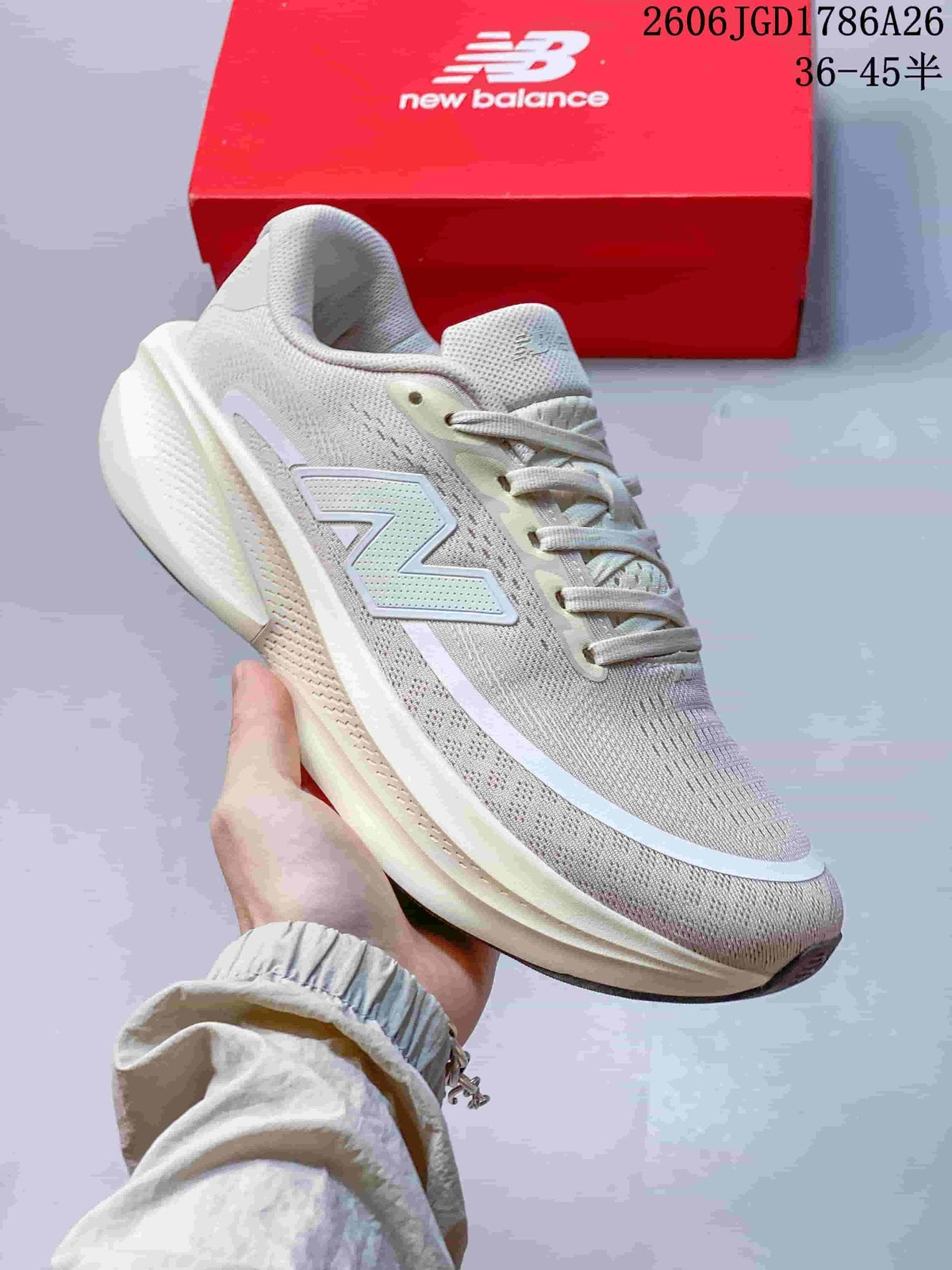 Close-up side view of a light neutral New Balance Ellipse V1 shoe