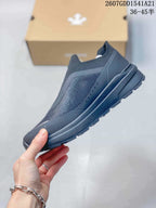Side profile of the low-top slip-on sneaker showing the textured upper, layered midsole, and outsole.