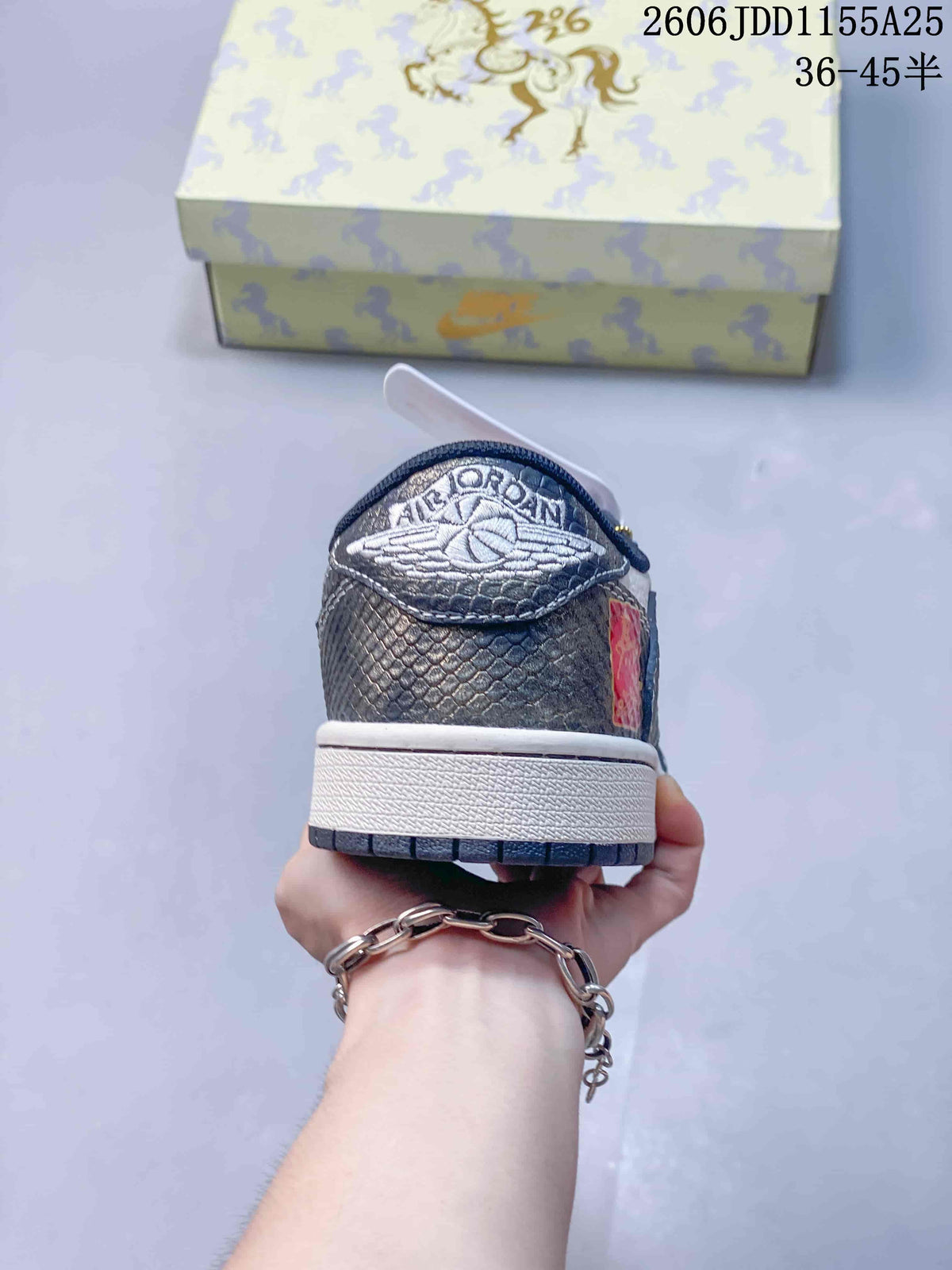 Rear view showing the heel panel, embroidered winged branding, white midsole, and dark outsole.