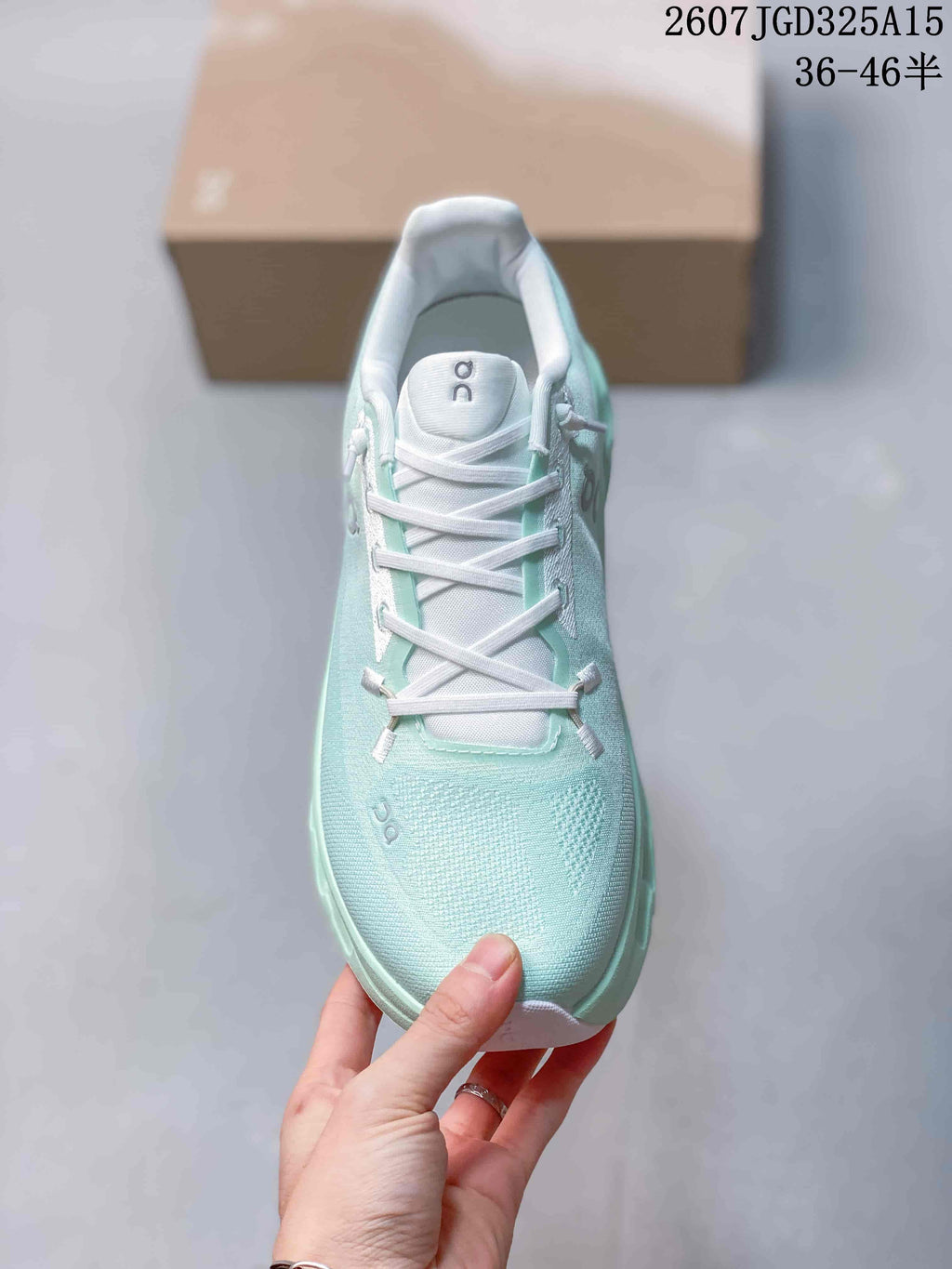 Top view of the mint green sneaker showing the rounded toe, white laces, and padded tongue.